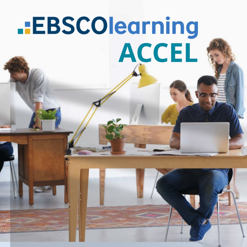 Office environment with two working at computers with two onlookers in the background