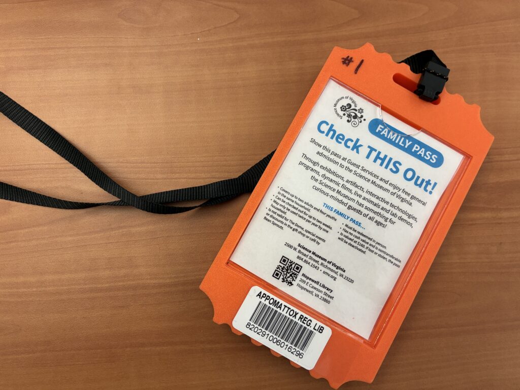 VA Science Pass in an orange "Ticket Admit One" holder